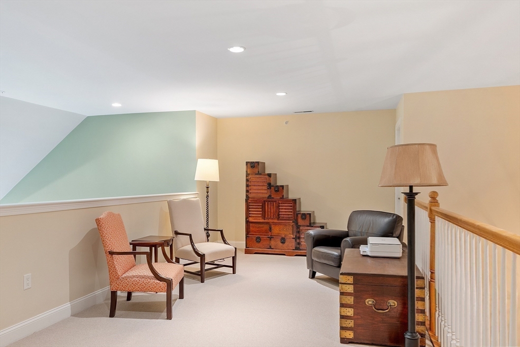 51 South Cottage Road, Unit 112 Belmont, MA 02478 - Photo 21 of 41 a view of a workspace with furniture and a lamp