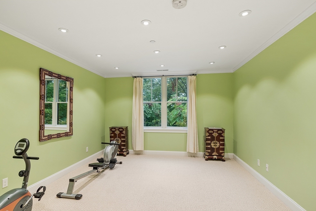 51 South Cottage Road, Unit 112 Belmont, MA 02478 - Photo 29 of 41 a view of a room with gym equipment
