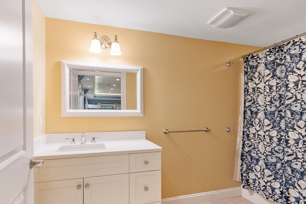 51 South Cottage Road, Unit 112 Belmont, MA 02478 - Photo 33 of 41 a bathroom with a sink and a mirror