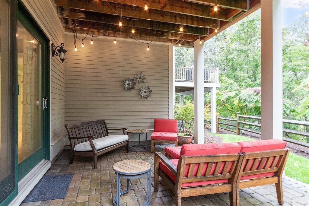 51 South Cottage Road, Unit 112 Belmont, MA 02478 - Photo 35 of 41 a outdoor living space with patio furniture and a potted plant
