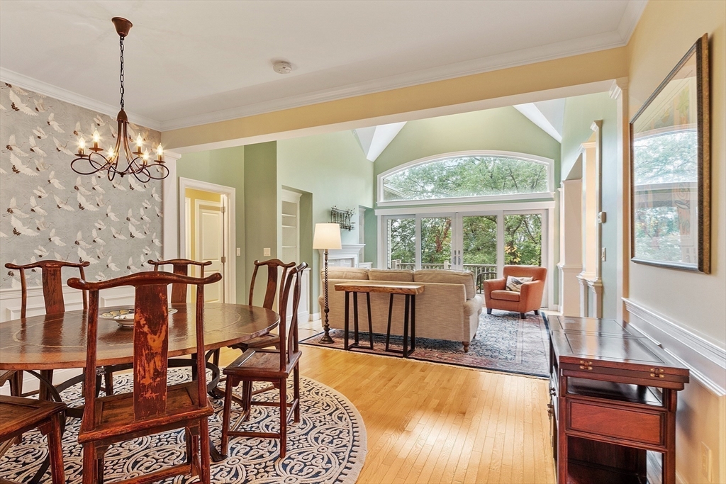 51 South Cottage Road, Unit 112 Belmont, MA 02478 - Photo 6 of 41 a dining room with furniture a chandelier and wooden floor