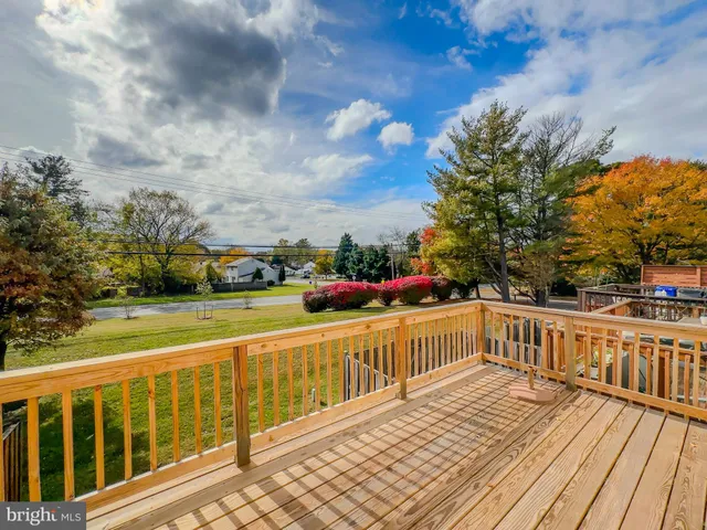 a view of a balcony with wooden floor