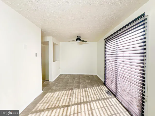 a view of a room with a wooden floor