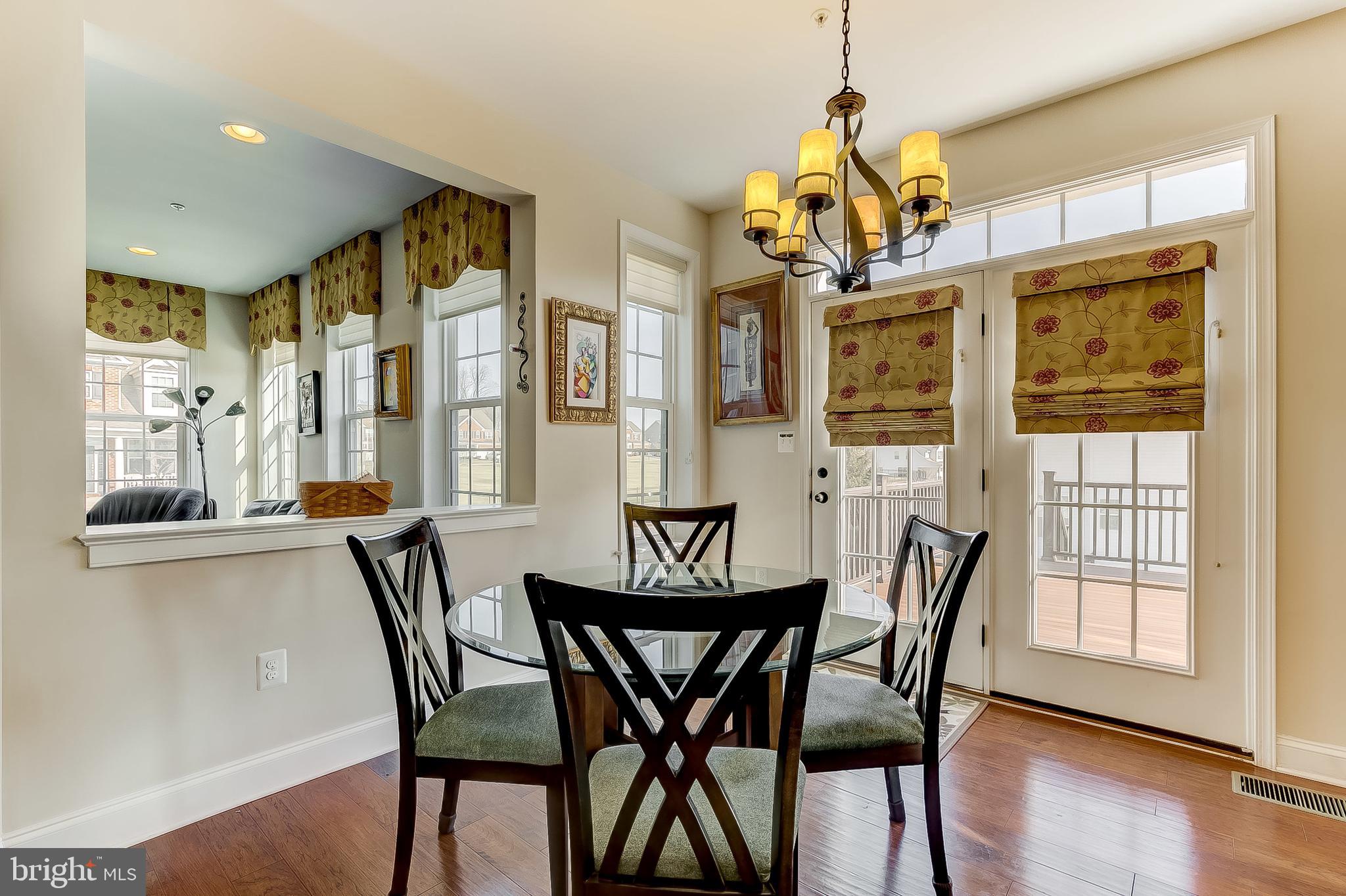2376 Sweet Meadow Road Baltimore, MD 21209 - Photo 8 of 34 Breakfast nook & yellow gold silk valances