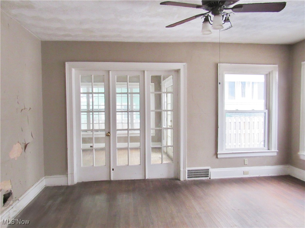14450 Superior Road Cleveland, OH 44118 - Photo 6 of 35 Entryway with ceiling fan, baseboards, wood finished floors, and visible vents
