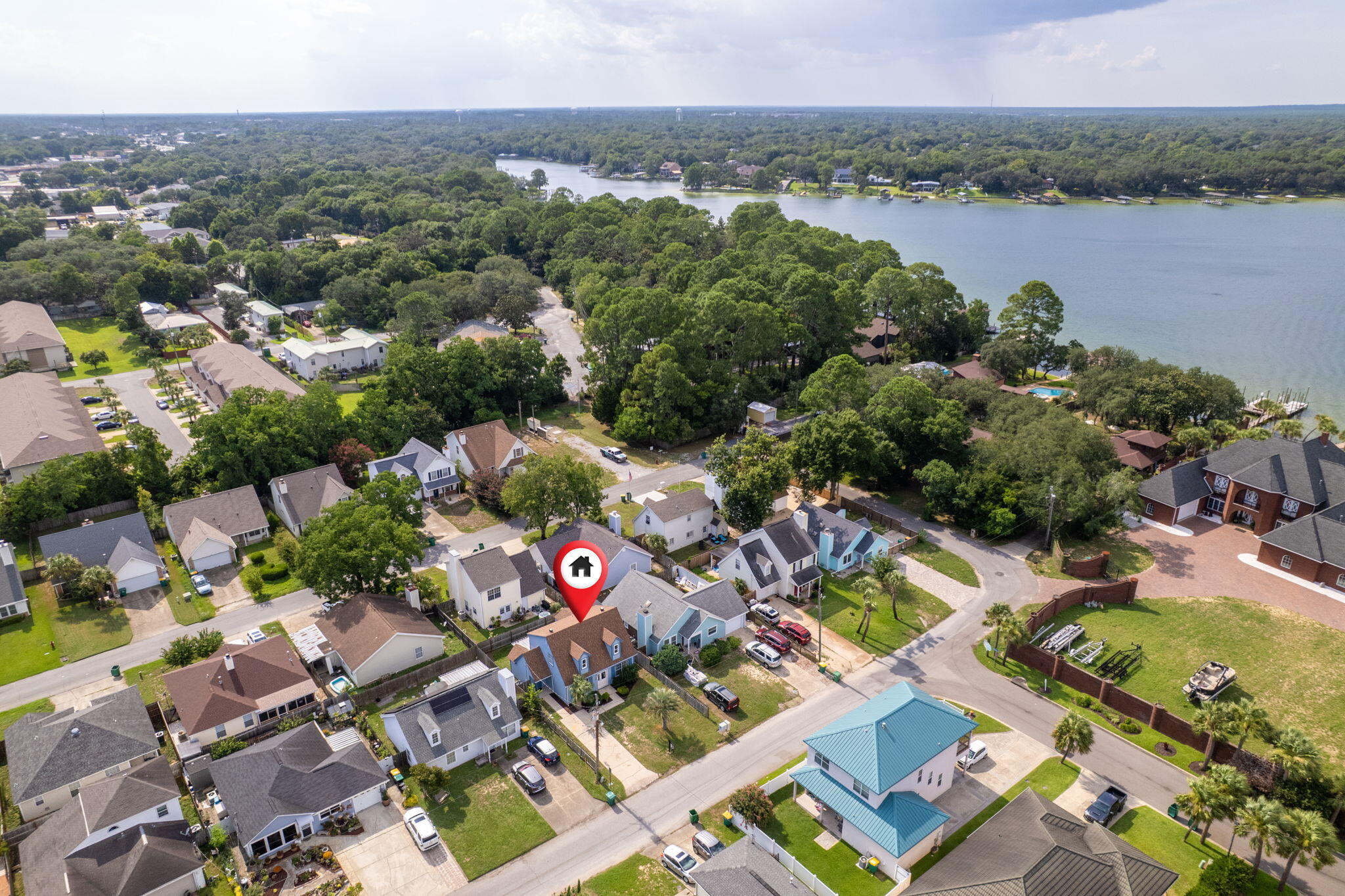 an aerial view of a city with lake view
