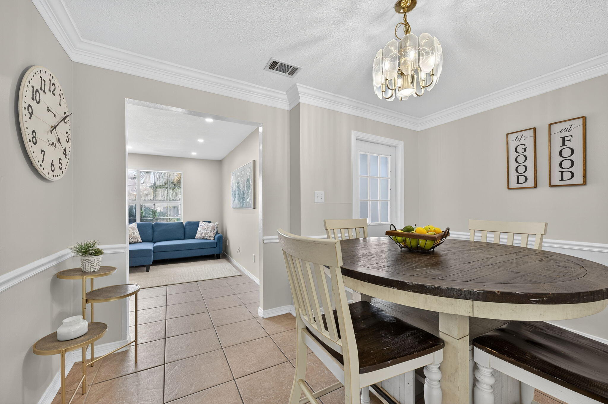 150 Beach Drive Fort Walton Beach, FL 32547 - Photo 12 of 56 a living room with dining table and a chandelier