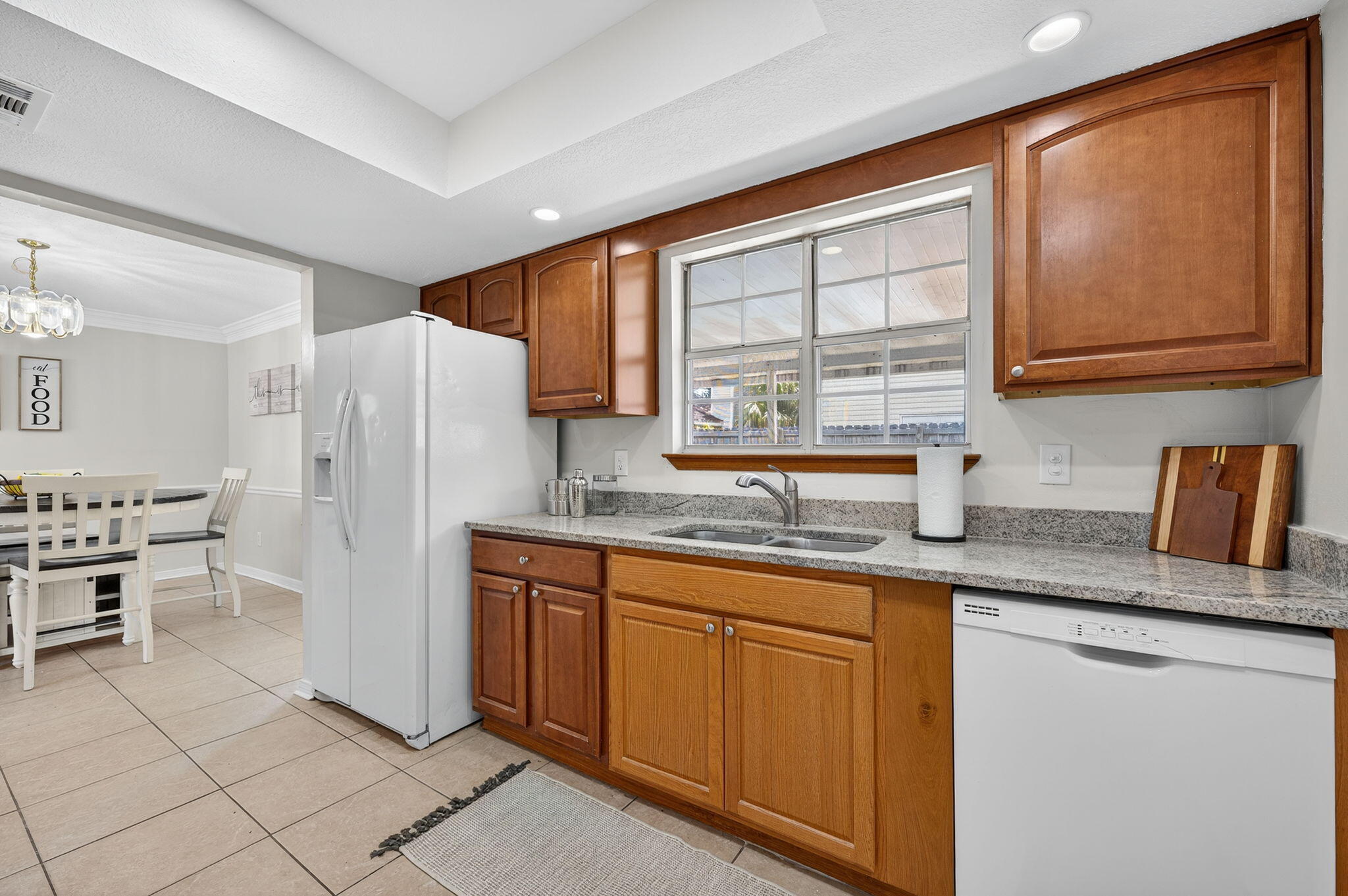 150 Beach Drive Fort Walton Beach, FL 32547 - Photo 19 of 56 a kitchen with stainless steel appliances granite countertop a sink and a refrigerator