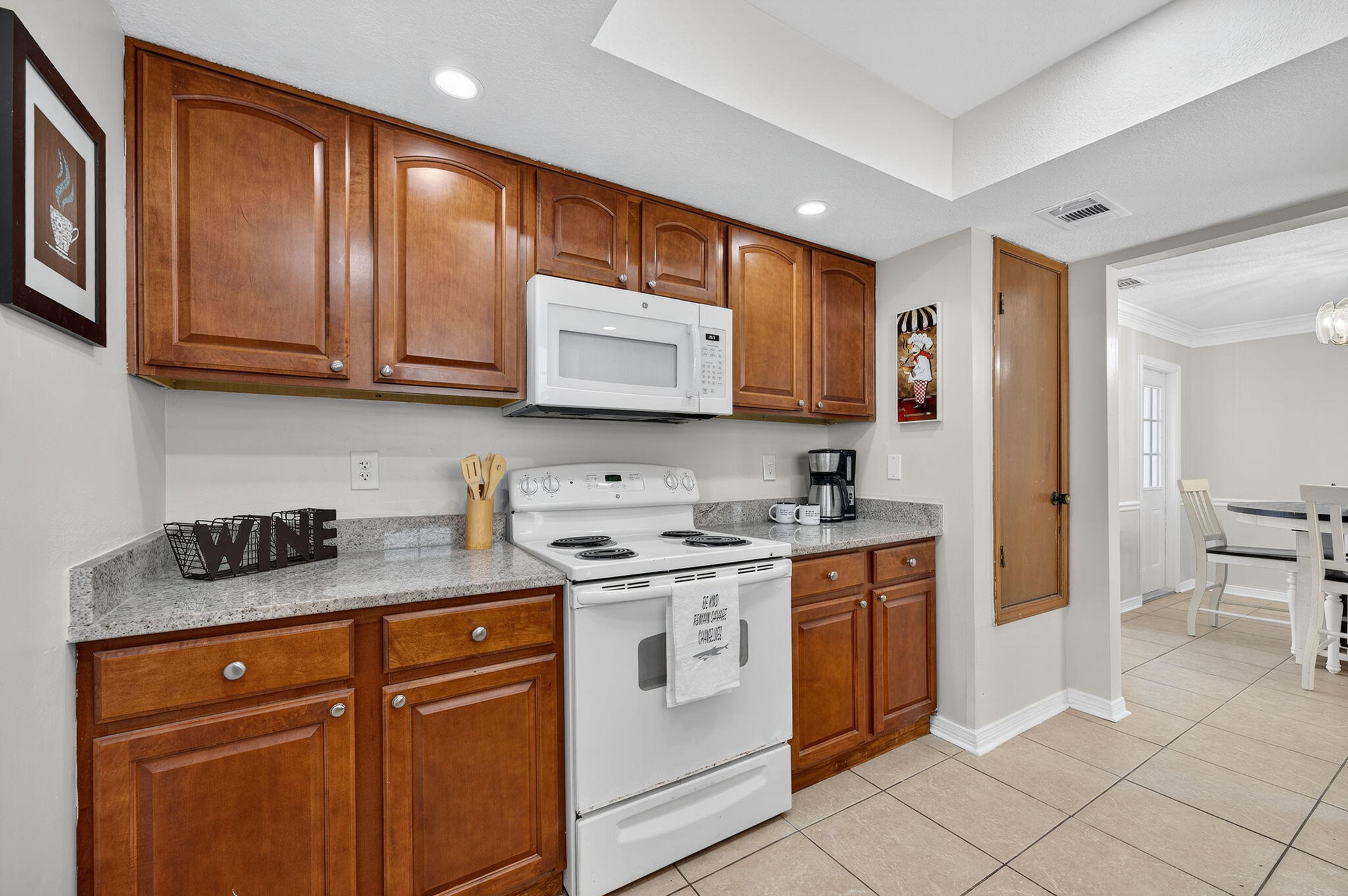 150 Beach Drive Fort Walton Beach, FL 32547 - Photo 20 of 56 a kitchen with stainless steel appliances granite countertop a stove a sink and a microwave