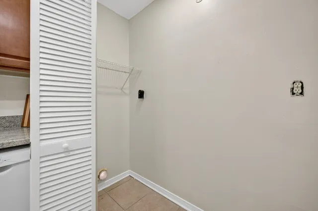 a spacious bedroom with a bed and a flat screen tv