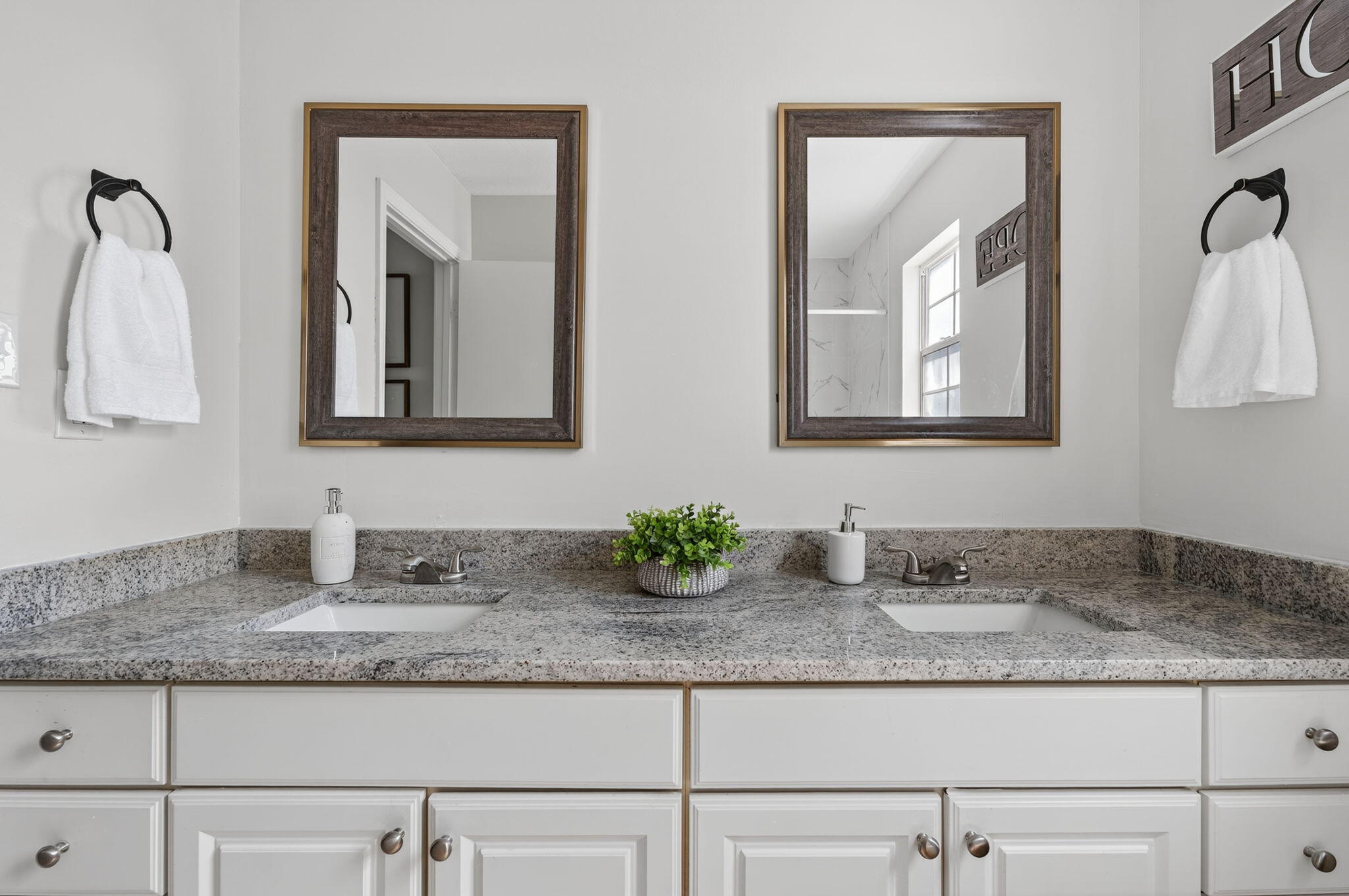 150 Beach Drive Fort Walton Beach, FL 32547 - Photo 29 of 56 a bathroom with granite countertop sink and mirror