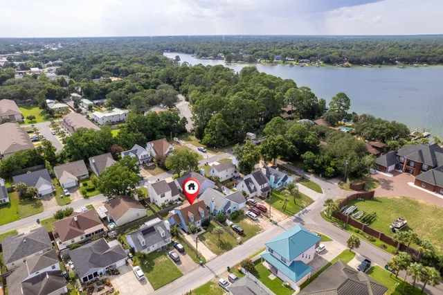 an aerial view of a city with lake view