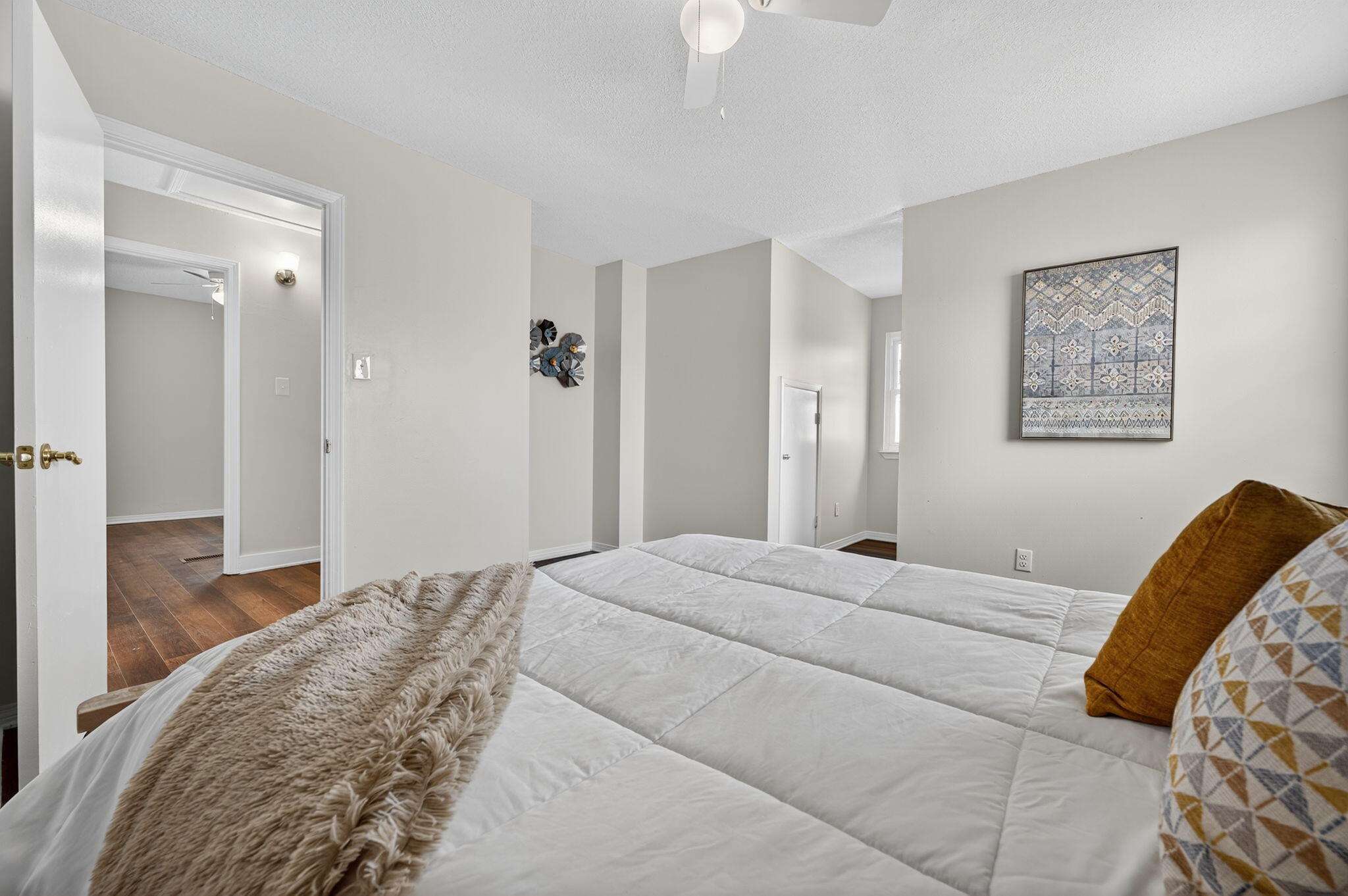 150 Beach Drive Fort Walton Beach, FL 32547 - Photo 32 of 56 a bedroom with a bed and a painting on the wall