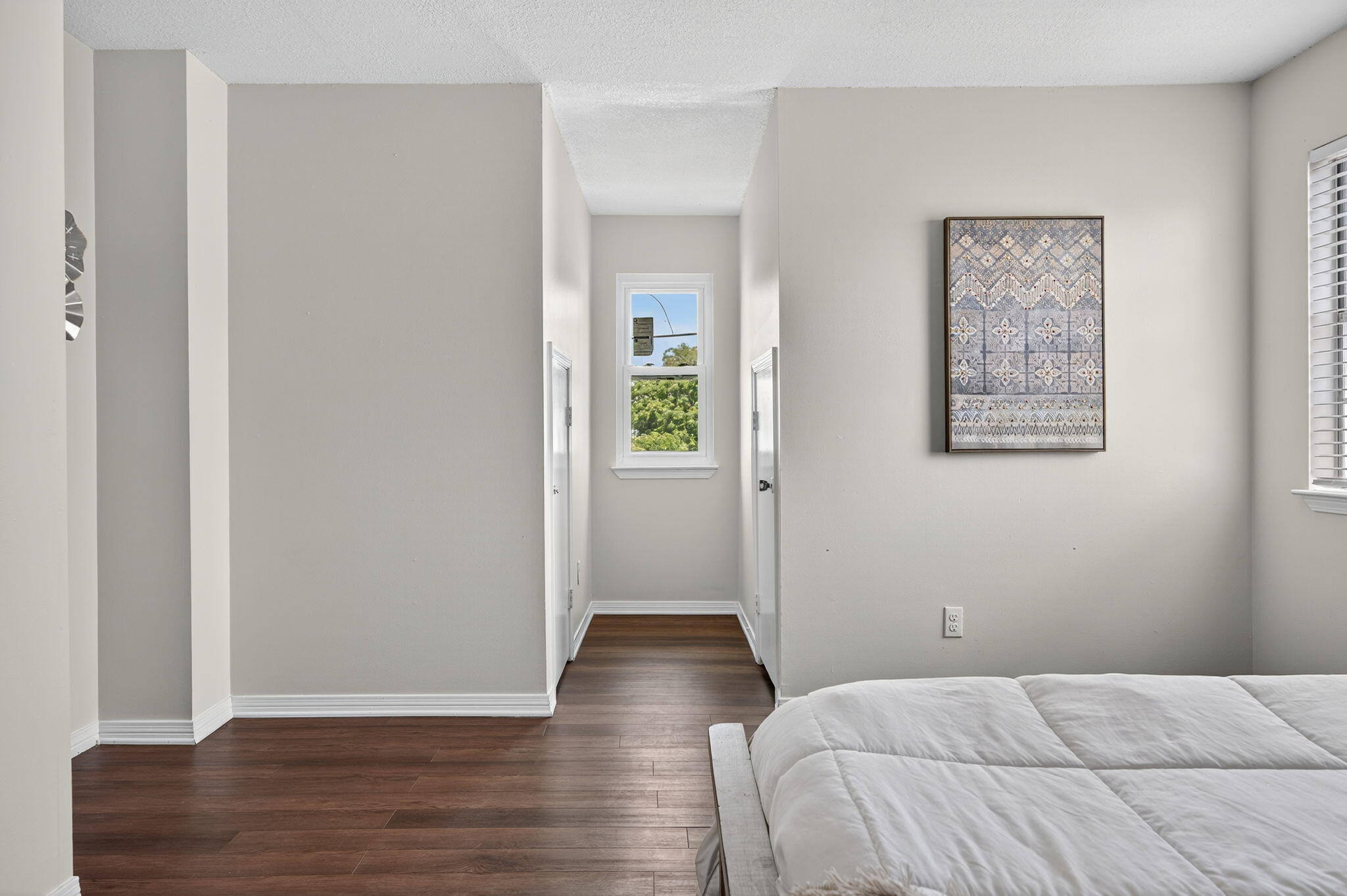 150 Beach Drive Fort Walton Beach, FL 32547 - Photo 33 of 56 a bedroom with a bed and wooden floor