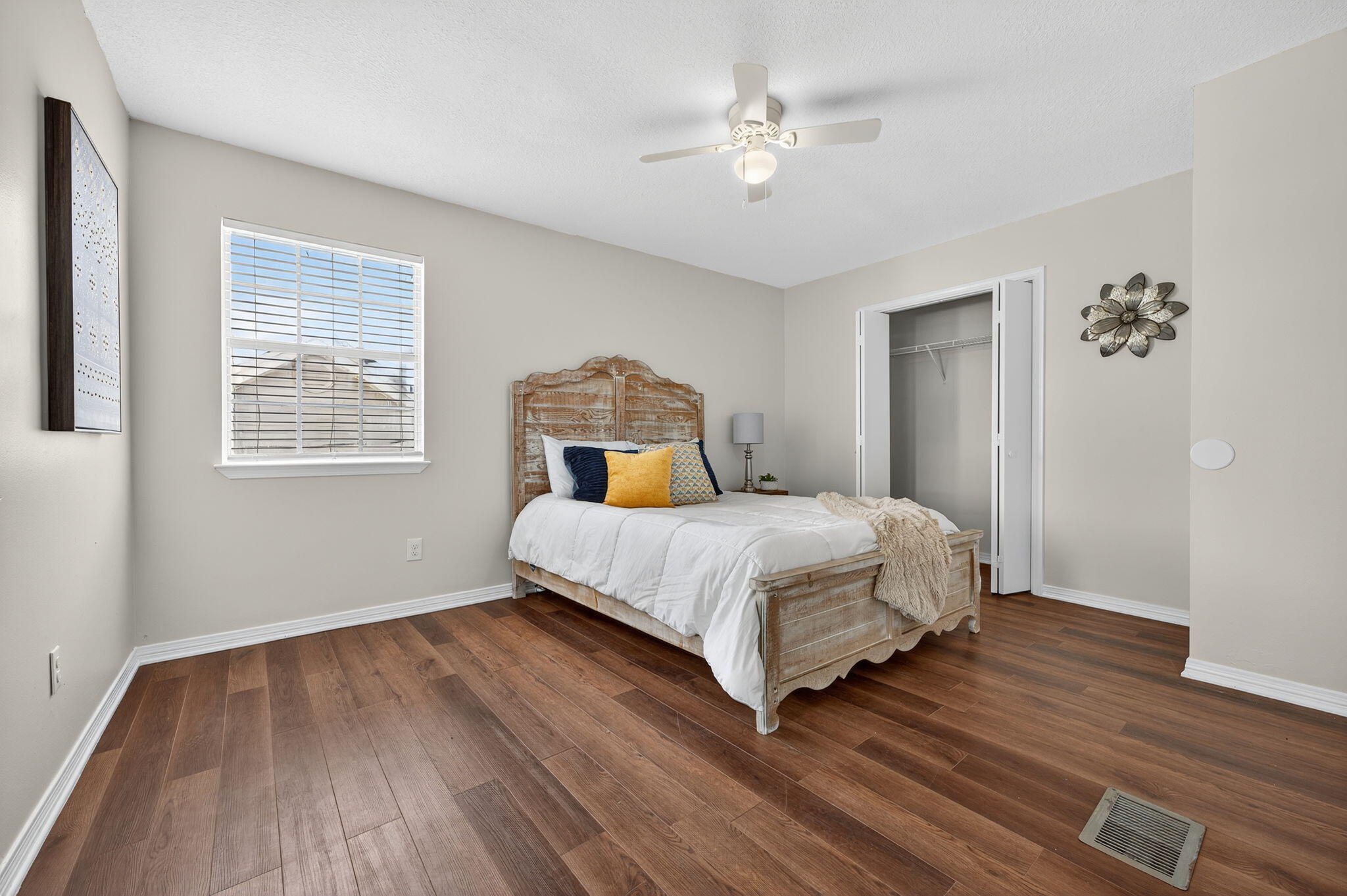 150 Beach Drive Fort Walton Beach, FL 32547 - Photo 34 of 56 a bedroom with a bed and wooden floor