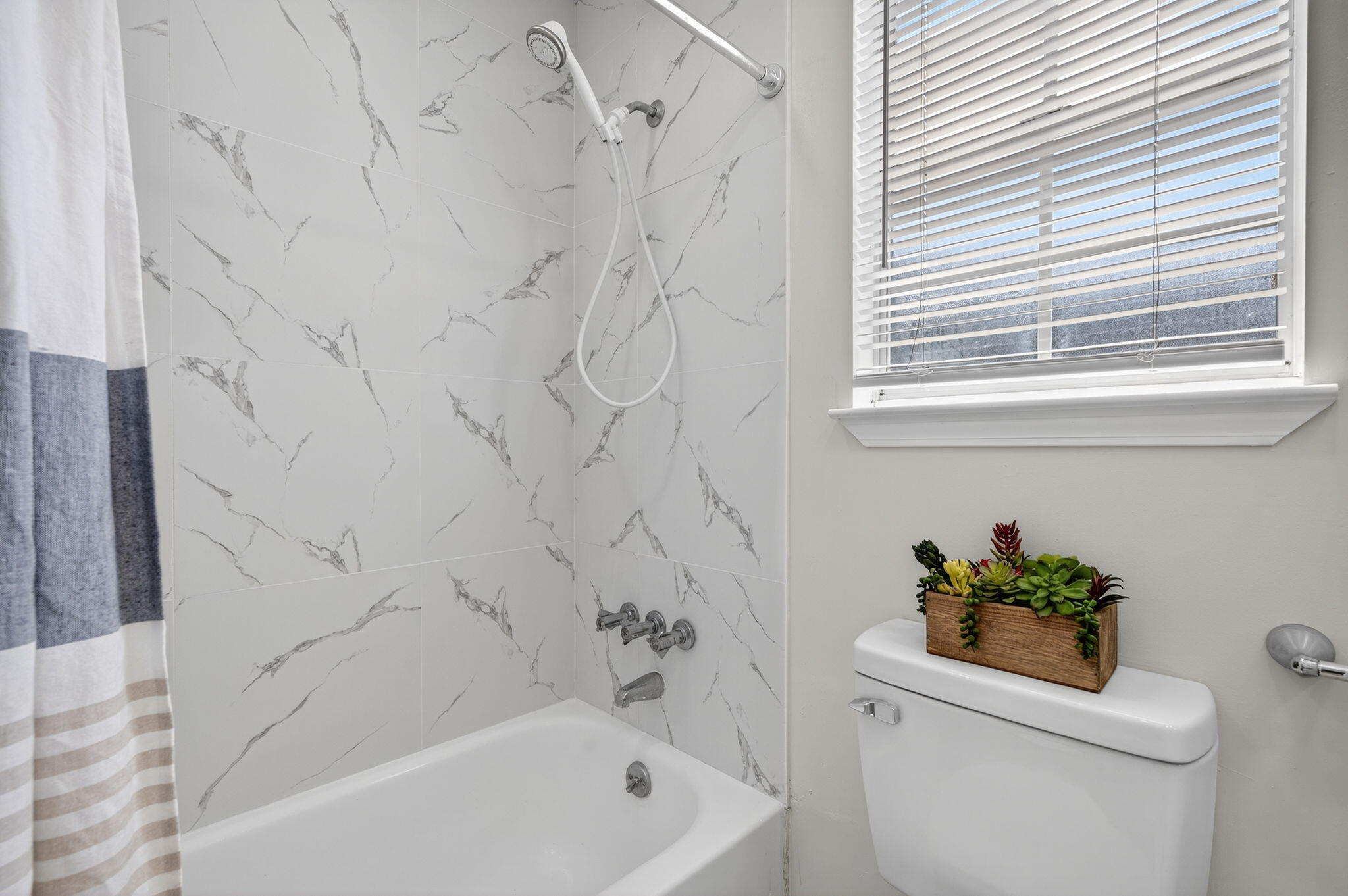 150 Beach Drive Fort Walton Beach, FL 32547 - Photo 38 of 56 a bath tub sitting next to a white sink and a toilet