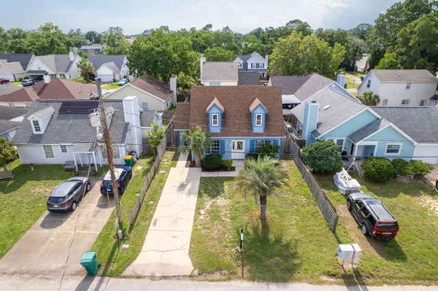 an aerial view of a house with a lake view