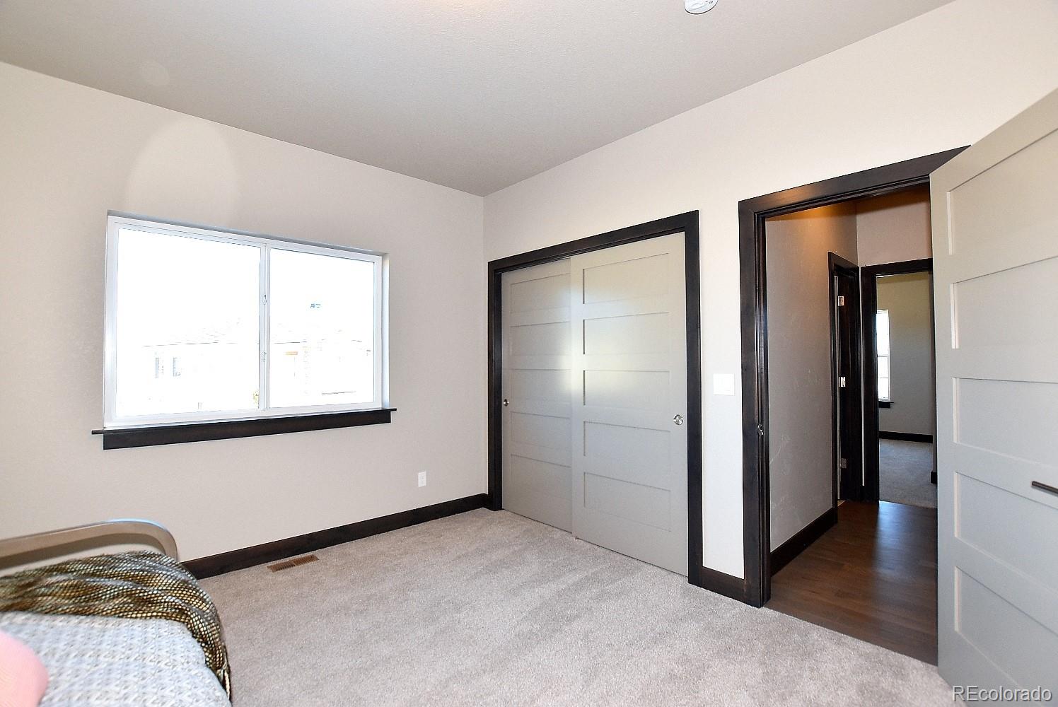 4792 Mariana Ridge Court Loveland, CO 80537 - Photo 29 of 39 a view of front door with a bedroom
