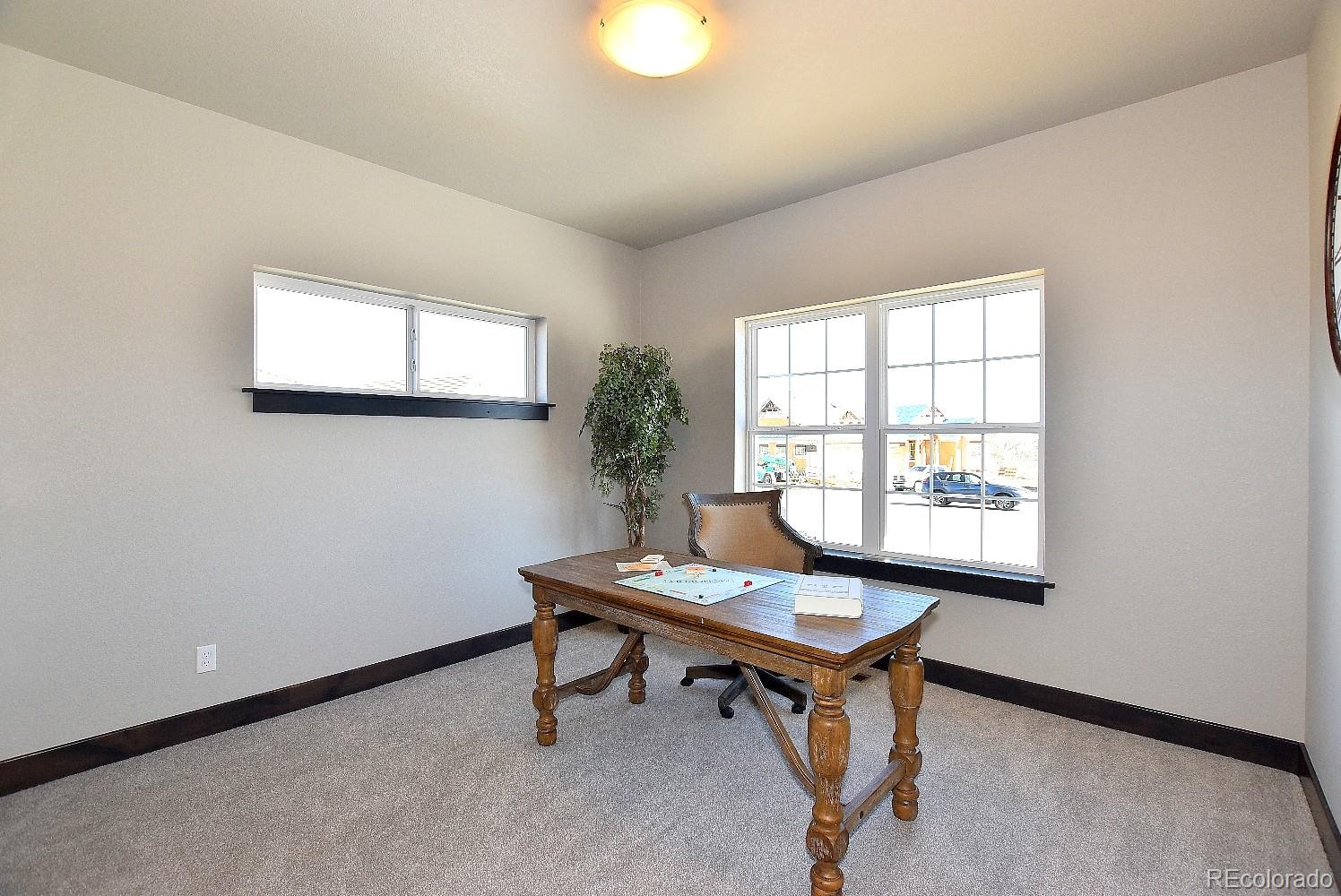 4792 Mariana Ridge Court Loveland, CO 80537 - Photo 33 of 39 a room with furniture and a window