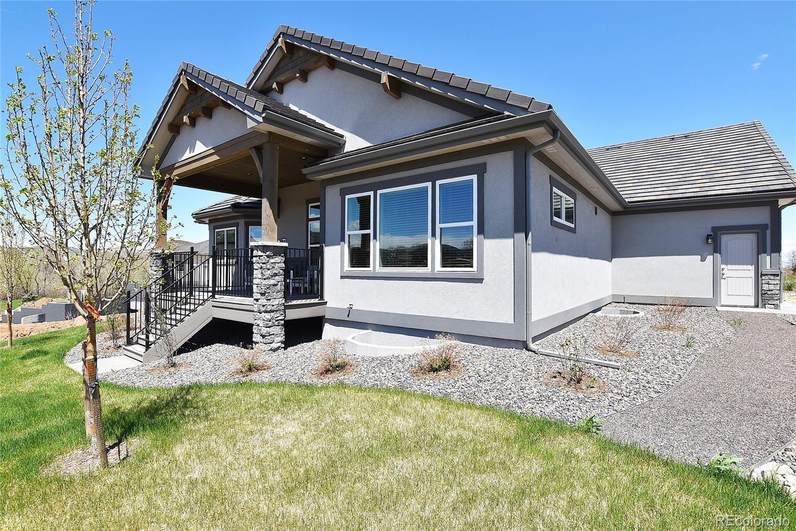 4792 Mariana Ridge Court Loveland, CO 80537 - Photo 38 of 39 front view of a house with a yard