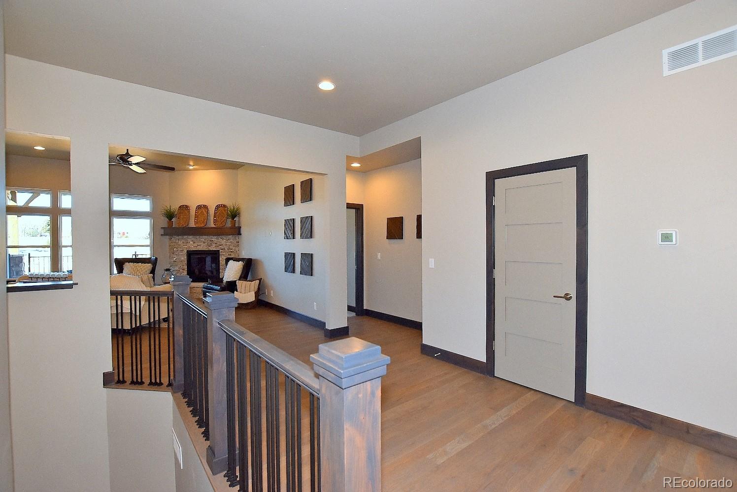 4792 Mariana Ridge Court Loveland, CO 80537 - Photo 4 of 39 a view of a kitchen with refrigerator and windows