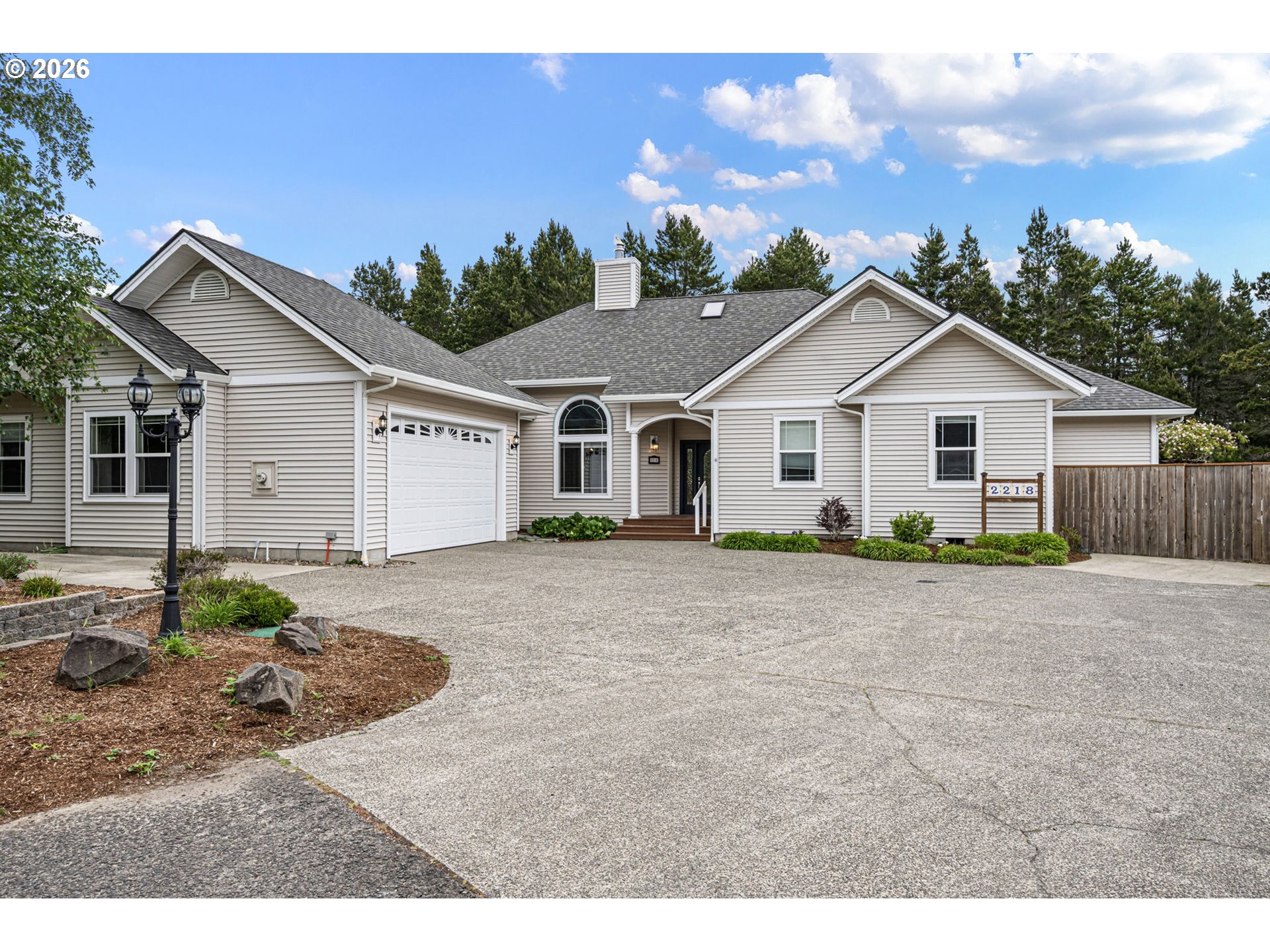 2218 Willow Loop Florence, OR 97439 - Photo 1 of 47 a view of a house with a patio