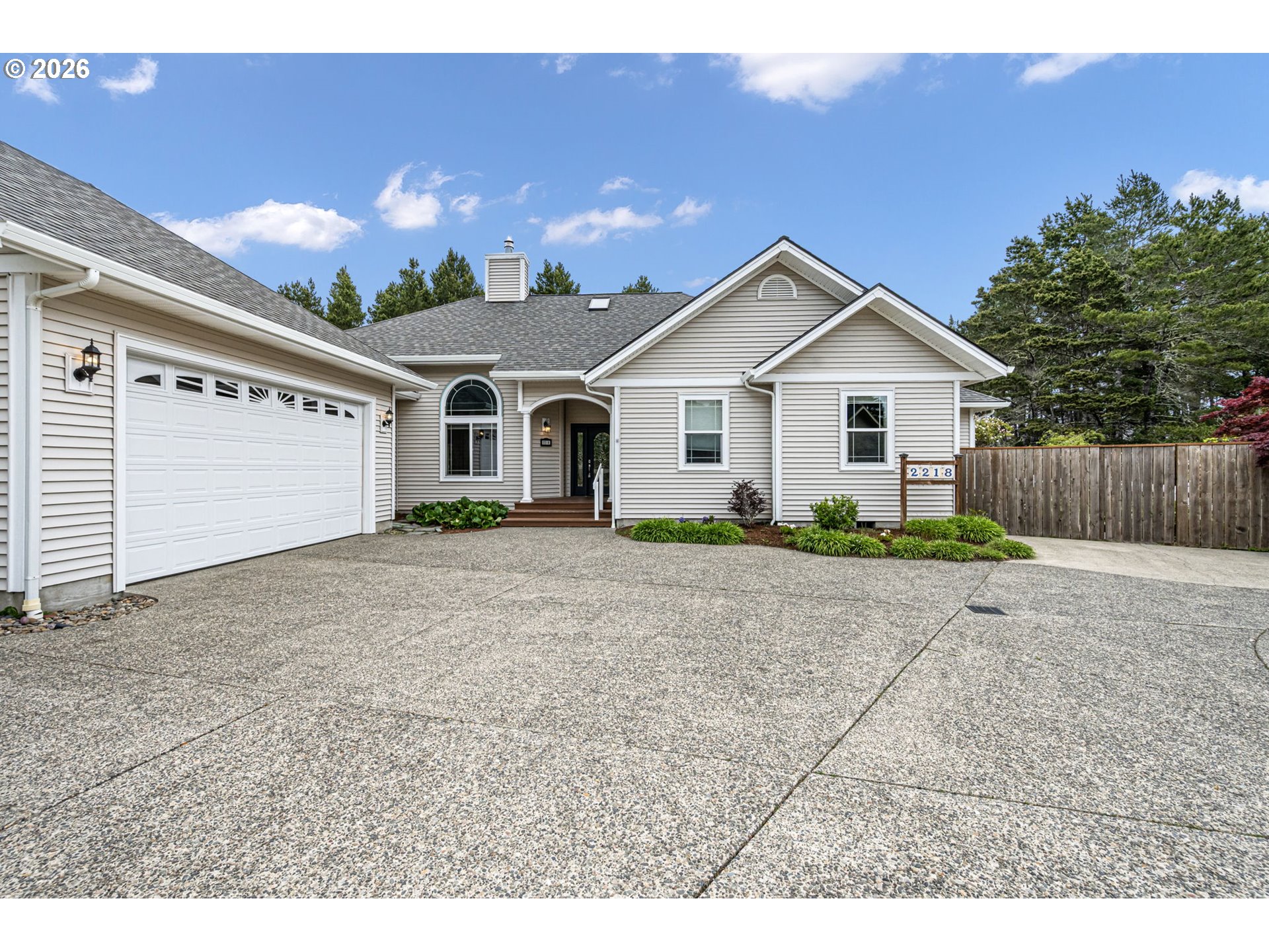 2218 Willow Loop Florence, OR 97439 - Photo 13 of 47 a view of a house with a yard and large tree