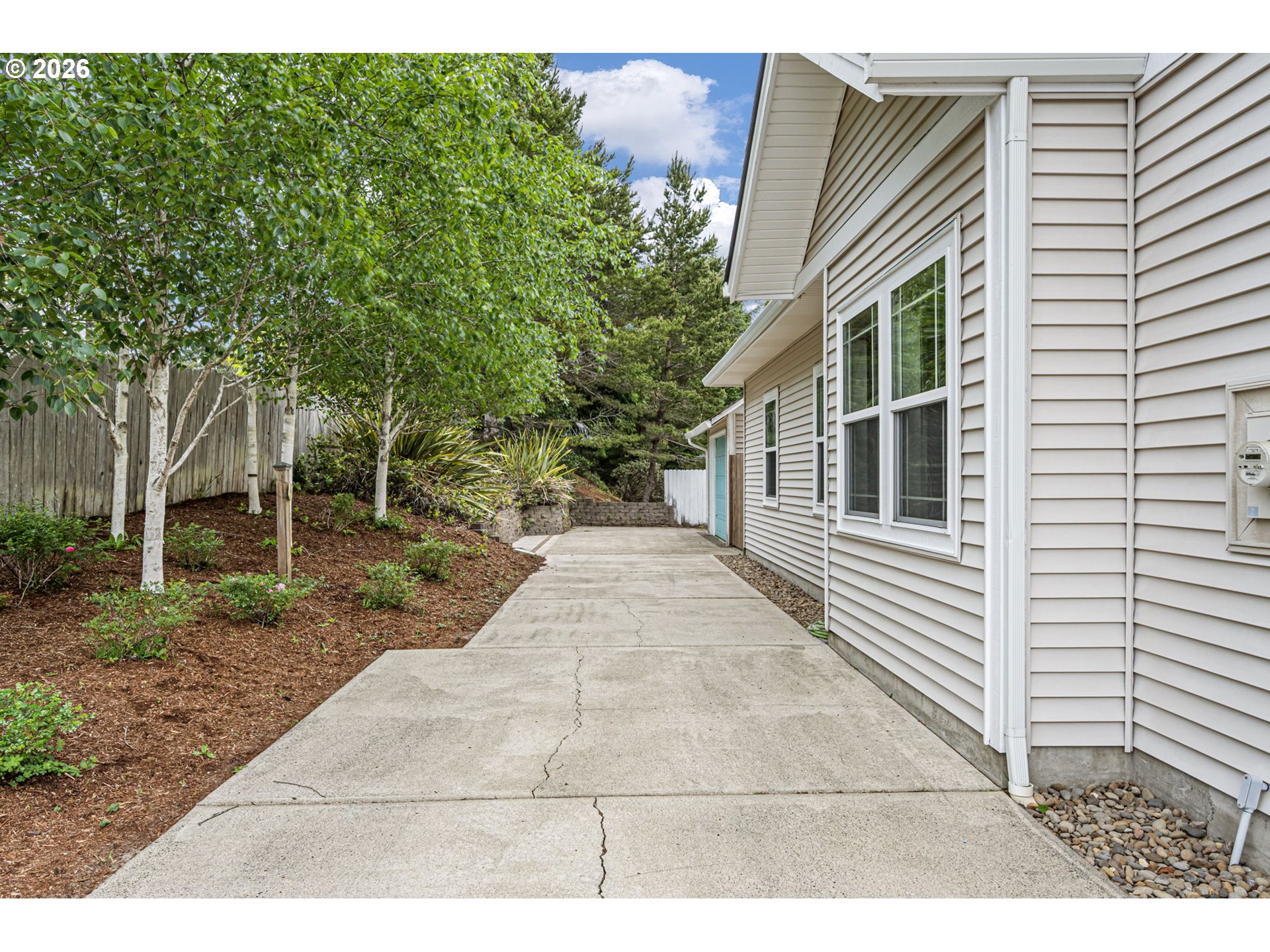2218 Willow Loop Florence, OR 97439 - Photo 14 of 47 a backyard of a house with outdoor seating