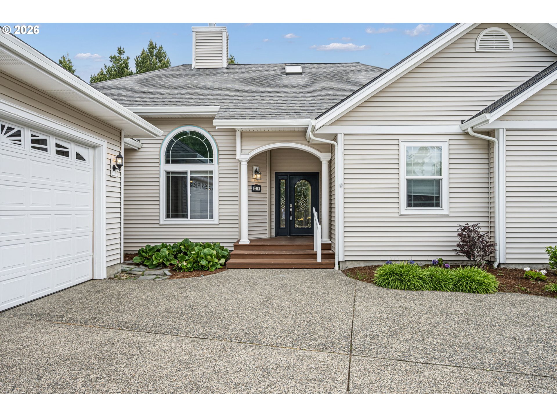 2218 Willow Loop Florence, OR 97439 - Photo 2 of 47 a front view of a house with garden