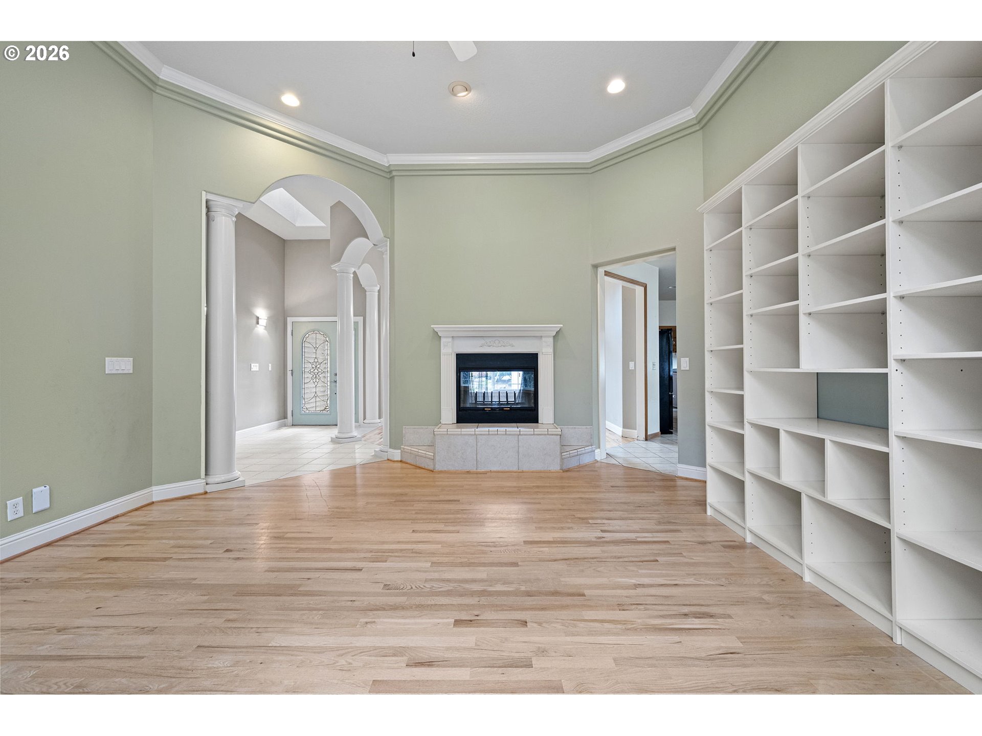 2218 Willow Loop Florence, OR 97439 - Photo 6 of 47 a view of an empty room with wooden floor and entryway