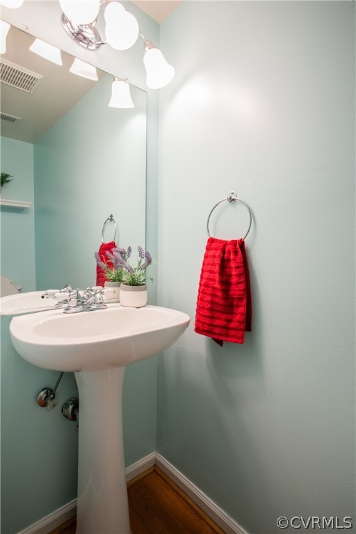 3248 Ransom Hills Road Richmond, VA 23237 - Photo 16 of 28 a bathroom with a sink and a mirror