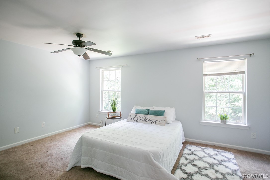 3248 Ransom Hills Road Richmond, VA 23237 - Photo 18 of 28 a bedroom with a bed and a window
