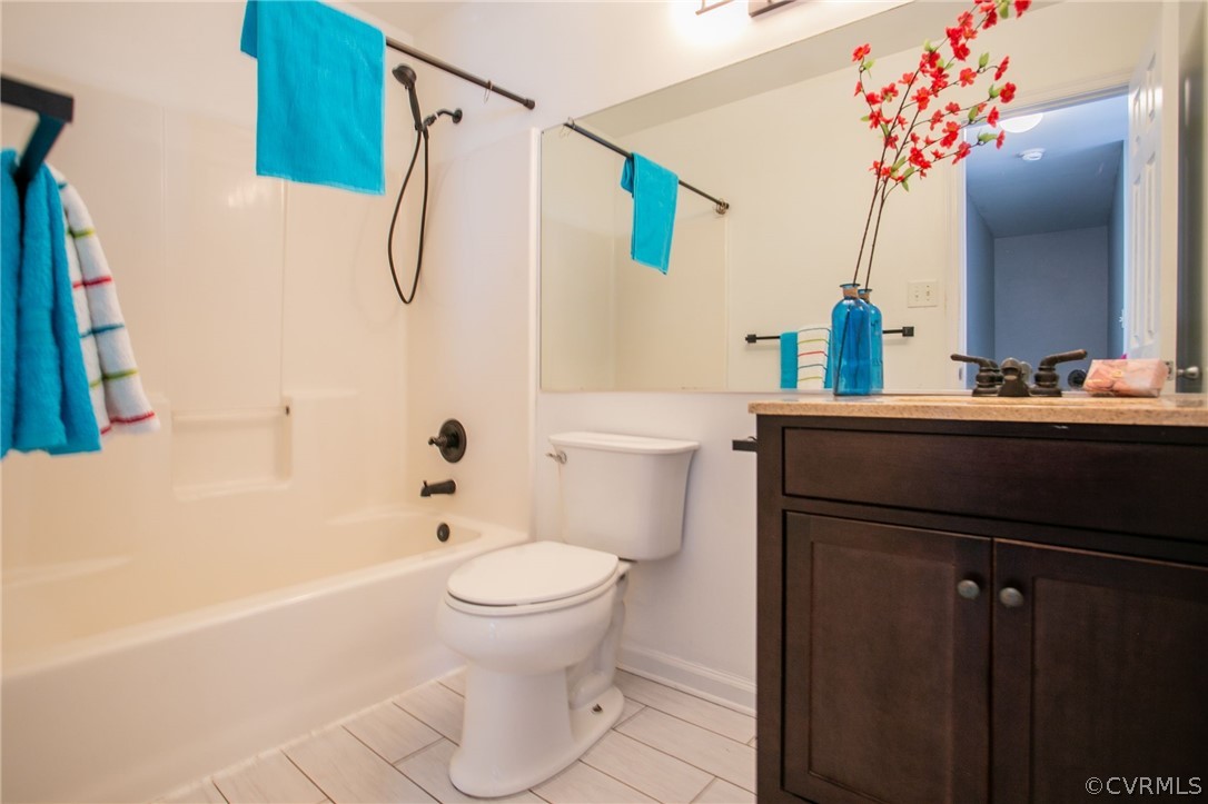 3248 Ransom Hills Road Richmond, VA 23237 - Photo 21 of 28 a bathroom with a sink a toilet and shower
