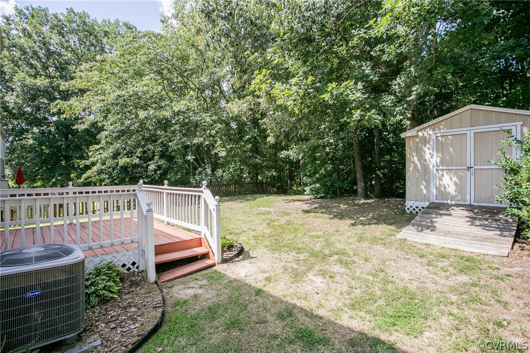 3248 Ransom Hills Road Richmond, VA 23237 - Photo 25 of 28 a view of a chair and table in the backyard