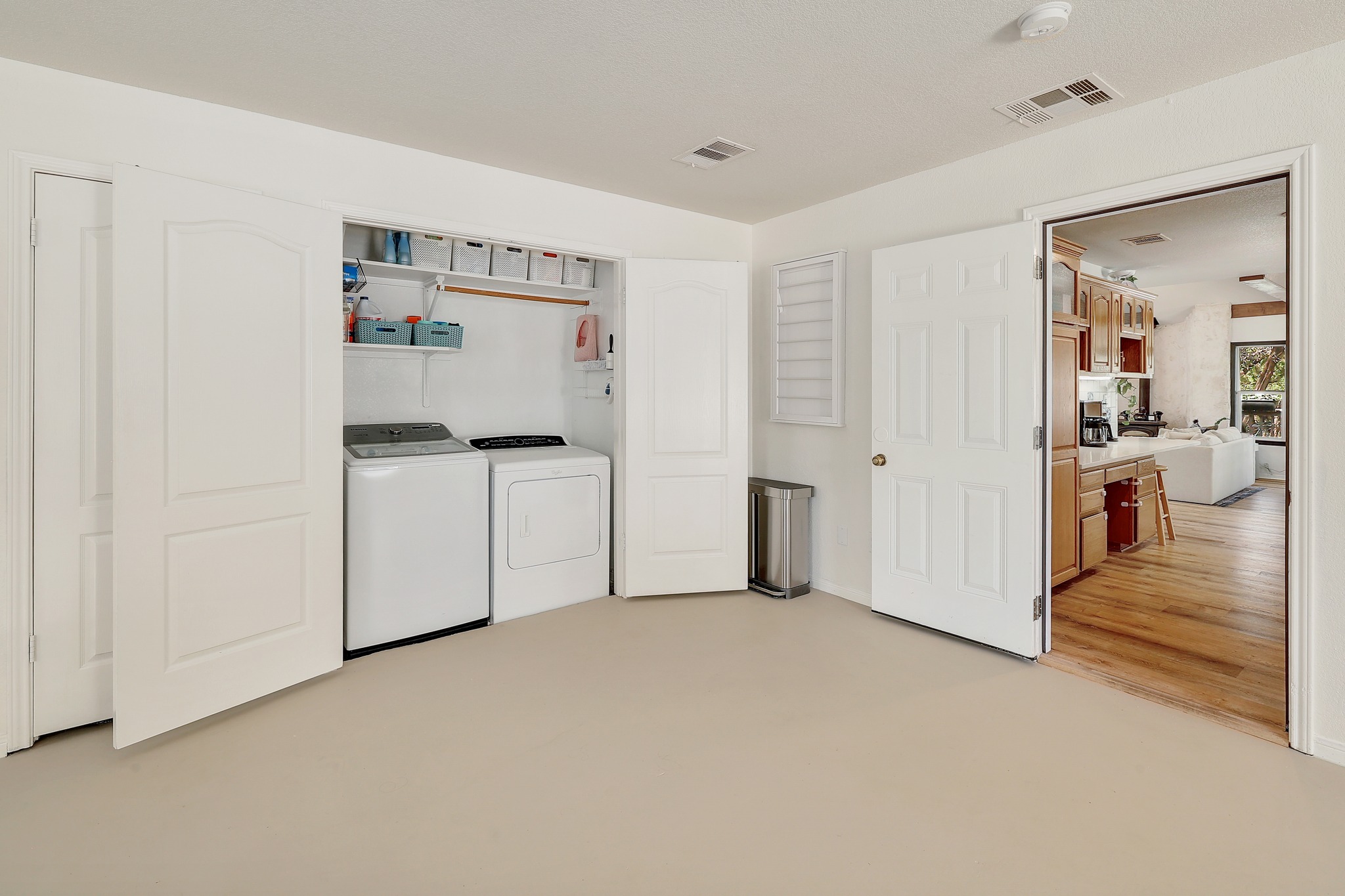 1455 County Road 262 Georgetown, TX 78633 - Photo 13 of 40 a view of a kitchen with refrigerator and white cabinets