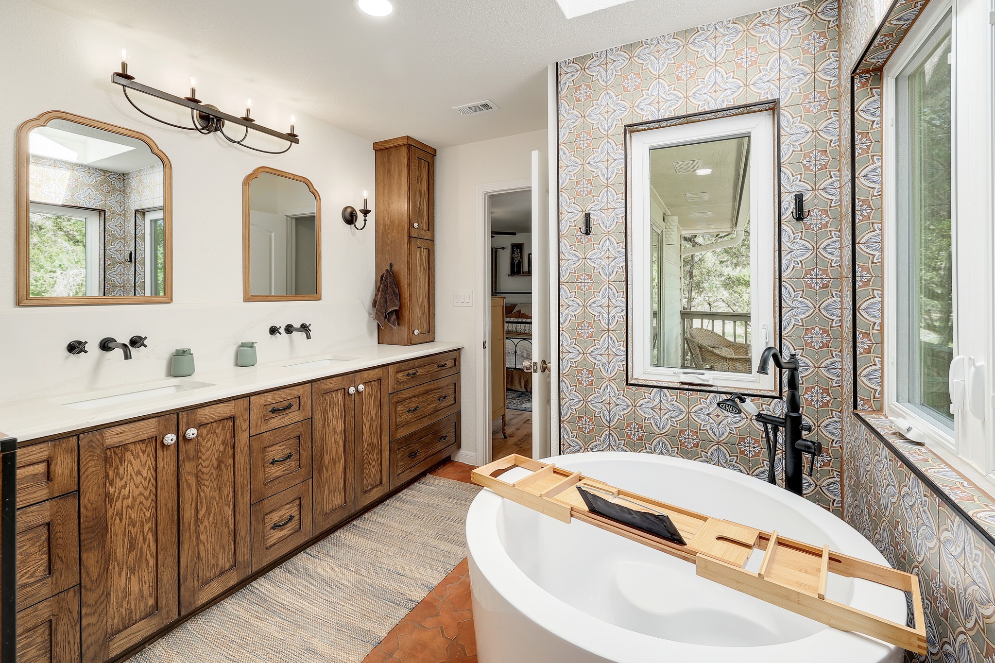1455 County Road 262 Georgetown, TX 78633 - Photo 17 of 40 a bathroom with a tub sink and mirror