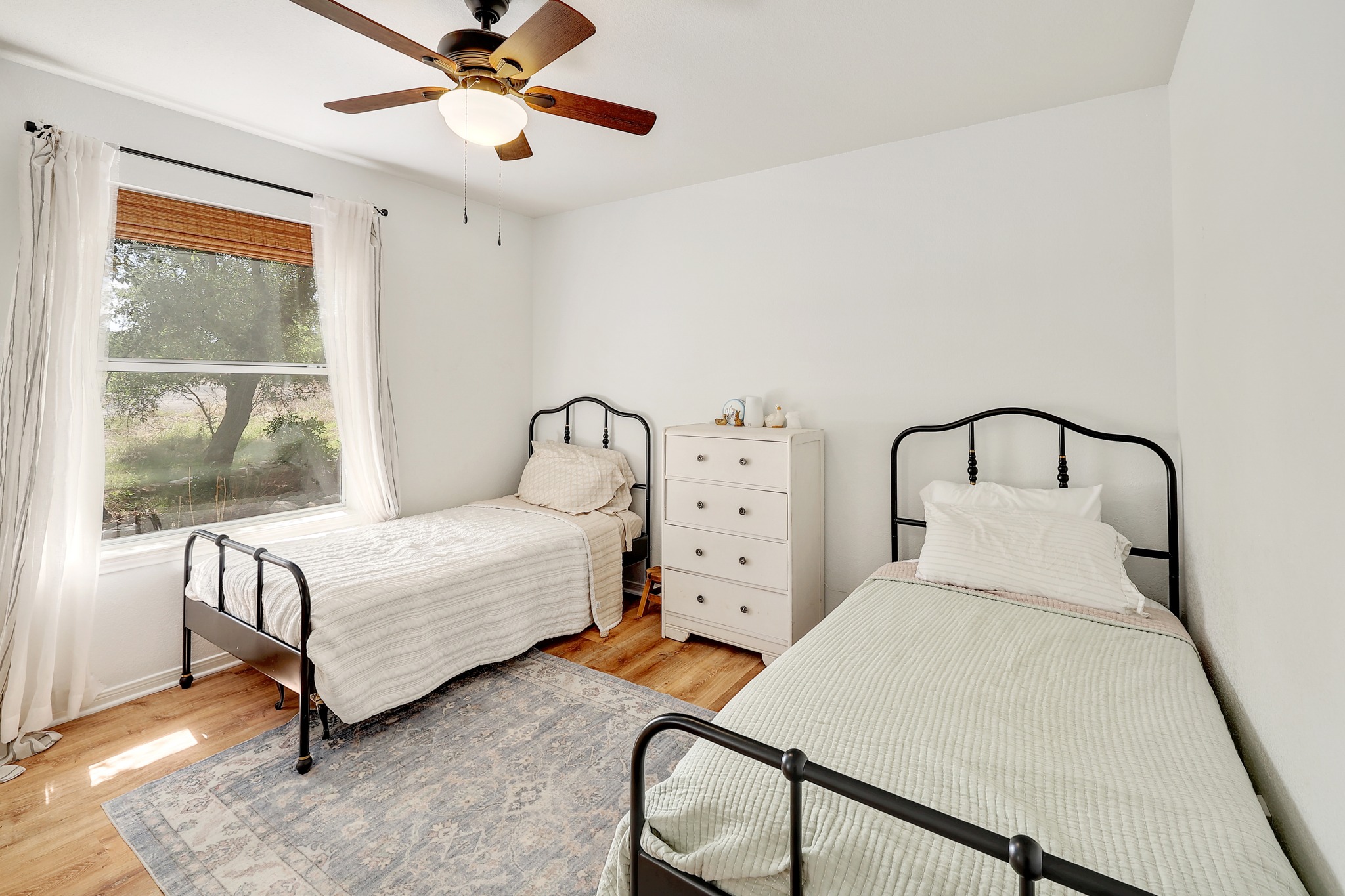 1455 County Road 262 Georgetown, TX 78633 - Photo 22 of 40 a bedroom with two beds and window