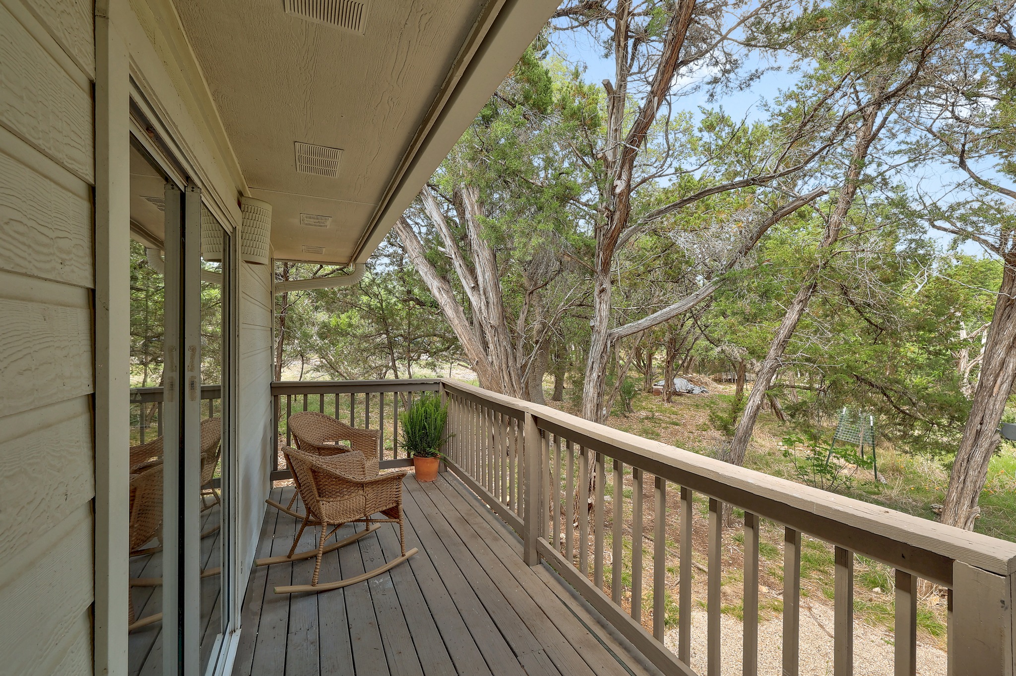 1455 County Road 262 Georgetown, TX 78633 - Photo 25 of 40 a balcony with wooden floor and outdoor seating