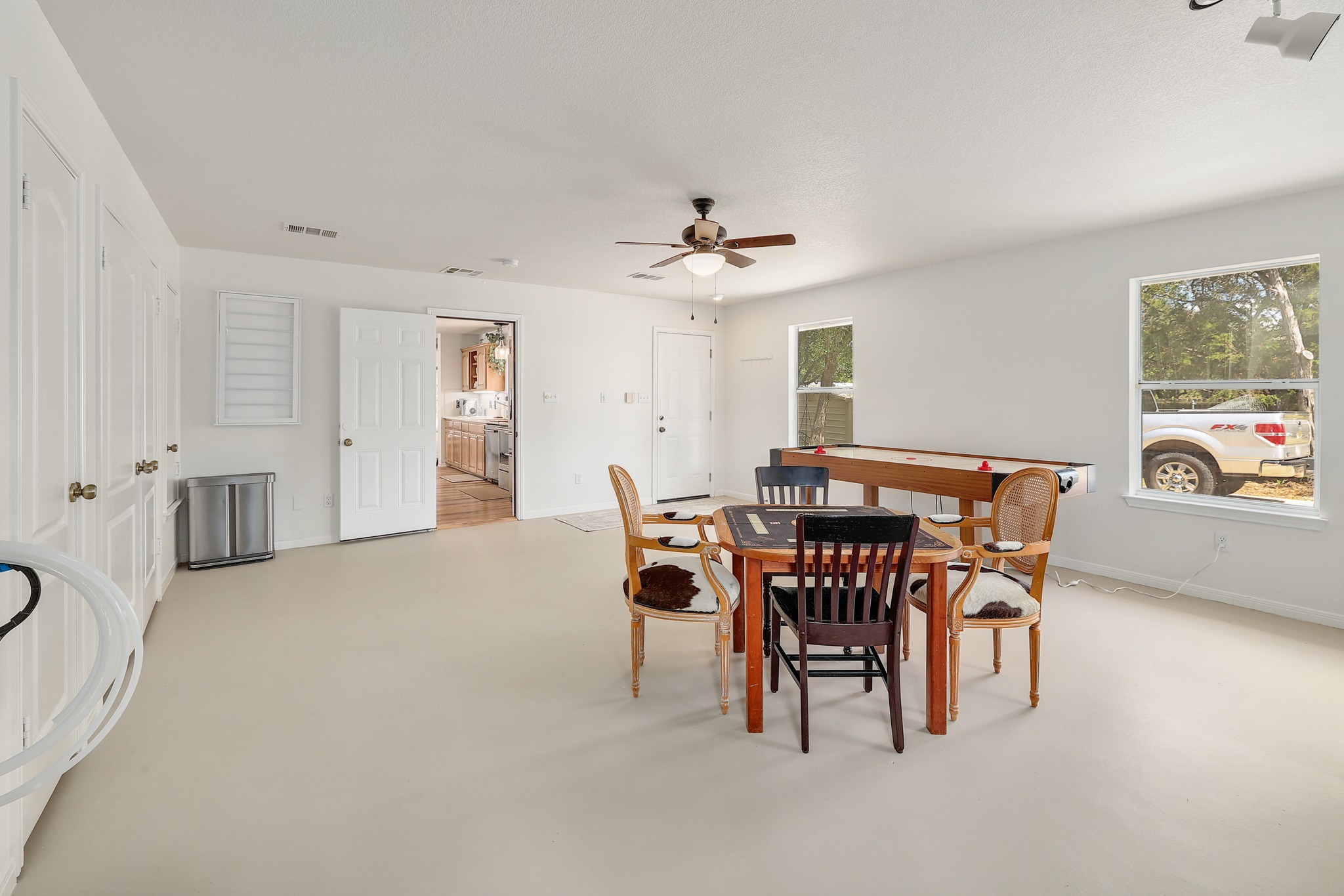 1455 County Road 262 Georgetown, TX 78633 - Photo 10 of 40 a view of a dining room with furniture and a chandelier