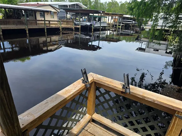 a balcony with table and chairs
