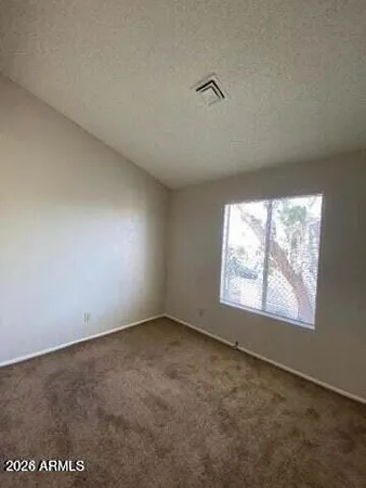 a bathroom with a sink a toilet a mirror and shower
