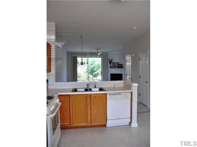 1711 Grace Brook Road Raleigh, NC 27609 - Photo 3 of 12 a kitchen with a sink and cabinets