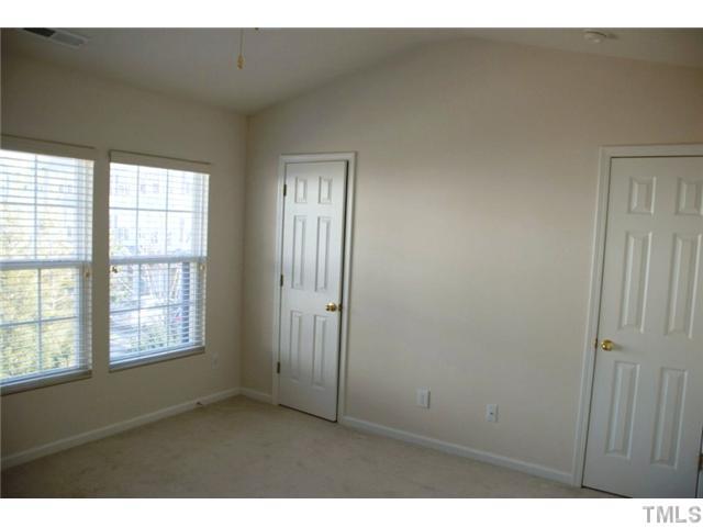 1711 Grace Brook Road Raleigh, NC 27609 - Photo 6 of 12 a view of an empty room with a window