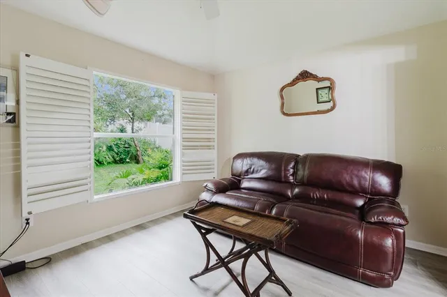 a living room with furniture and a window