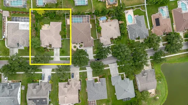 an aerial view of a house with a garden and a yard