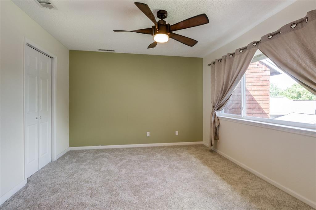 8404 Forest Lane, Unit 702 Dallas, TX 75243 - Photo 10 of 12 a view of an empty room with a window