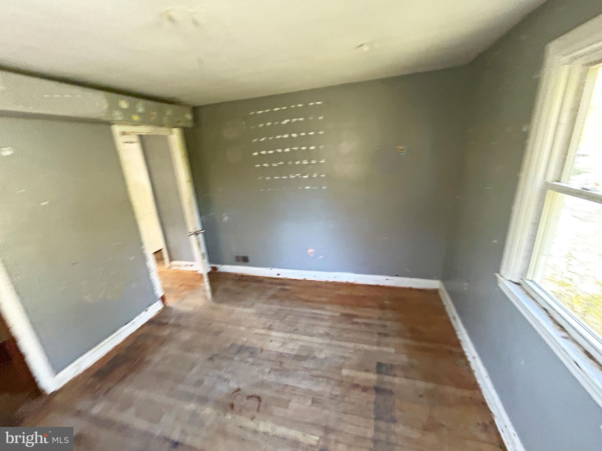 4407 Ridge Drive Baltimore, MD 21229 - Photo 16 of 18 an empty room with windows