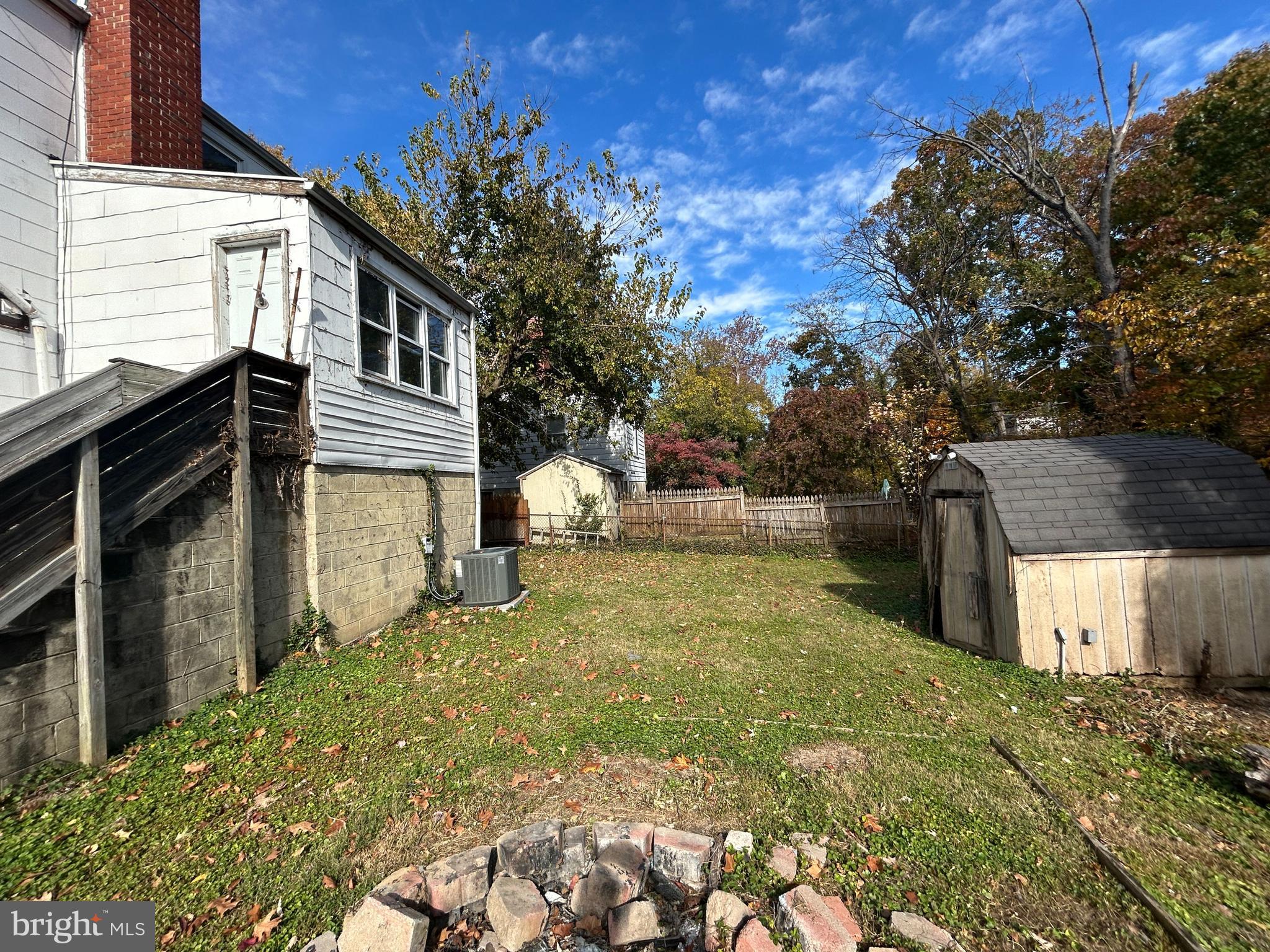 4407 Ridge Drive Baltimore, MD 21229 - Photo 6 of 18 a backyard of a house with oven and outdoor seating