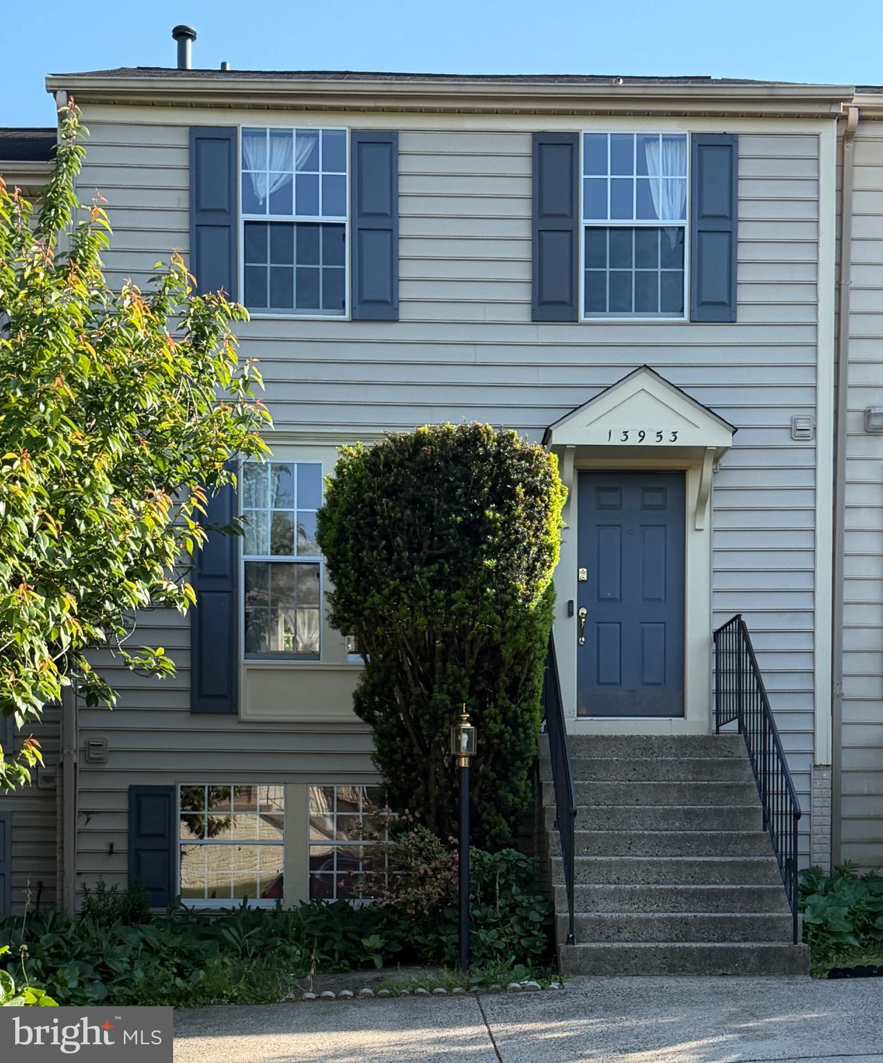 13953 Winding Ridge Lane Centreville, VA 20121 - Photo 1 of 23 a front view of a house with plants