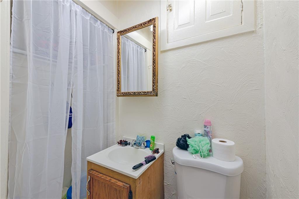 125 North Chestnut Street Butler, PA 16001 - Photo 13 of 25 a bathroom with a sink toilet and vanity